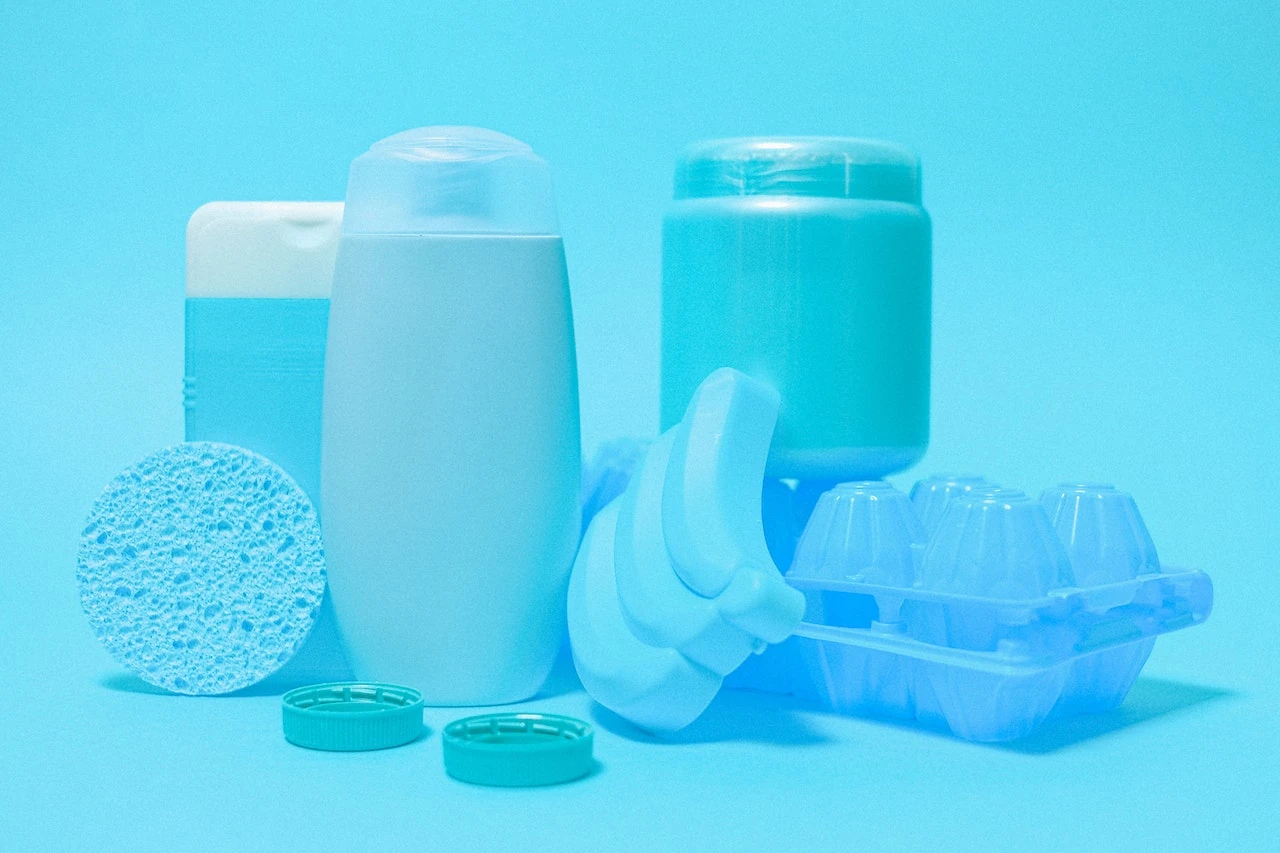 A collection of plastic skincare containers, highlighting the issue of plastic waste.
